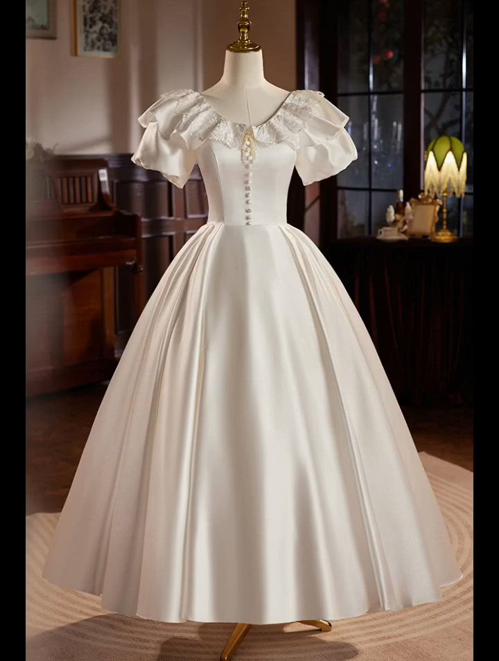 This contains: Retro Satin Ballgown Wedding Dress with Lace Neckline