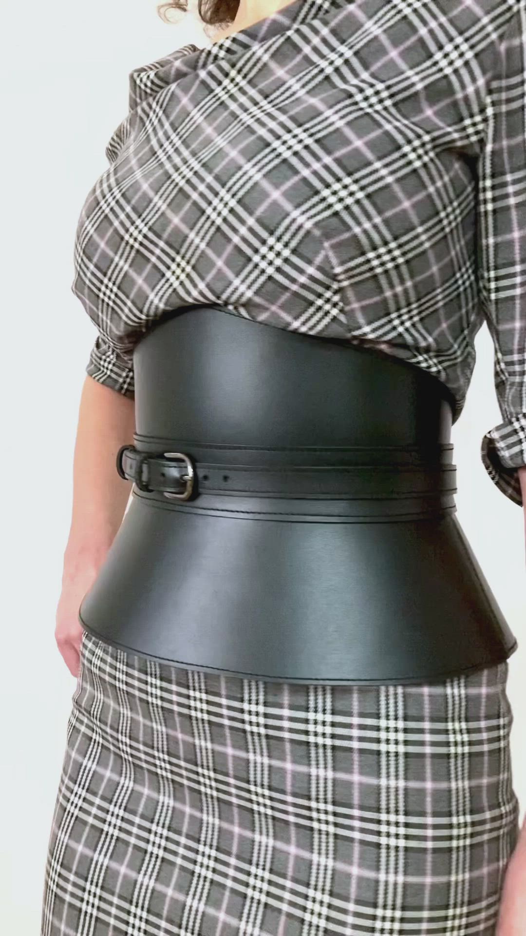 This contains: Black leather corset belt