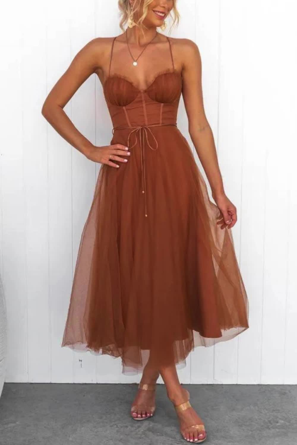 "Make a graceful entrance with our Chiffon Sling Party Midi Dress. This elegant dress features a lightweight chiffon fabric, a flattering midi length, and delicate spaghetti straps, perfect for any party or special occasion."