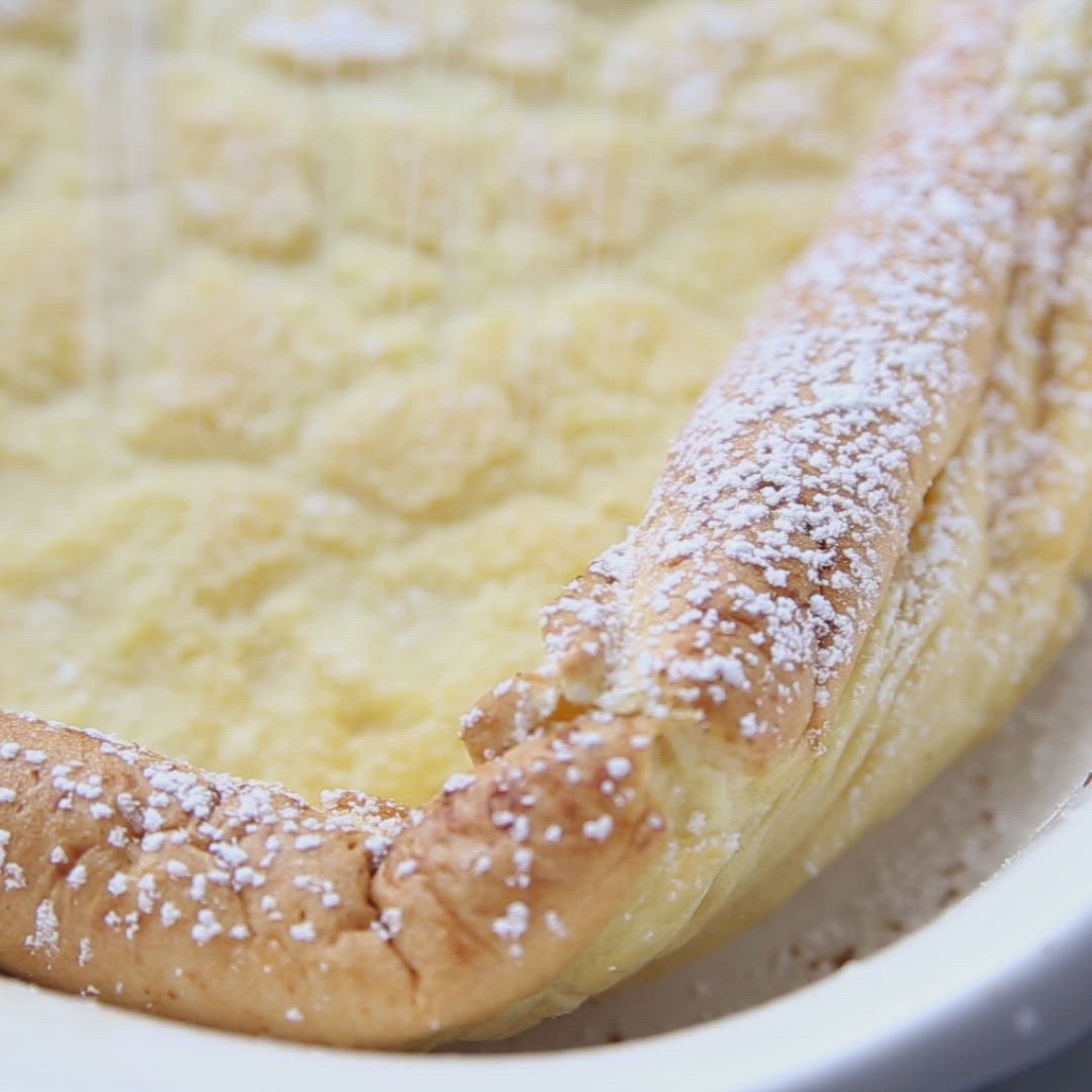 This may contain: a close up of a pastry in a white bowl with sugar on the rim and sprinkles