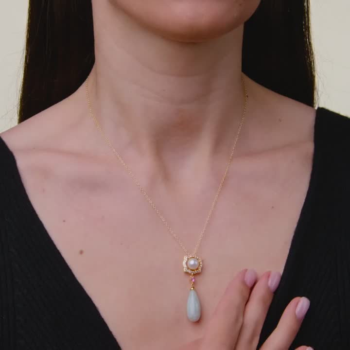 Add a touch of elegance to any ensemble with this eye-catching jade, white topaz, lab-created pink sapphire and freshwater cultured pearl Dynasty Jade 18k gold plated pendant necklace. Click on this JEWELRY & WATCHES GUIDE to learn about fit, styles, materials and more! FEATURES Pendant dimensions: 44 mm x 13.1 mm Chain length: 18 in. Chain type: cable Clasp: lobster-claw Nickel safe Metal: sterling silver Plating: 18k gold Finish: polished Packaging: boxedSTONE DETAILS Stone type: jadeite jade, lab-created pink sapphire, white topaz Total weight: 13 1/2 ct. Center stone weight: 13 ct. Center stone size: 22 mm x 9.5 mm Shape: pear, round Setting: glue/epoxy, pave, prongCULTURED PEARL DETAILS Type: freshwater Diameter: 7.5 mm - 8 mm Shape: near round Color: white Gemstones may have been tre