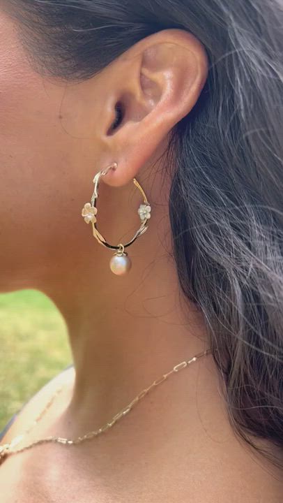 The elegant plumeria makes a bold move with these plumeria inspired hoop earrings.