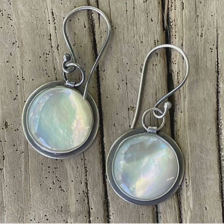 Beautiful handmade round white mother of pearl earrings, carefully crafted to capture timeless elegance.