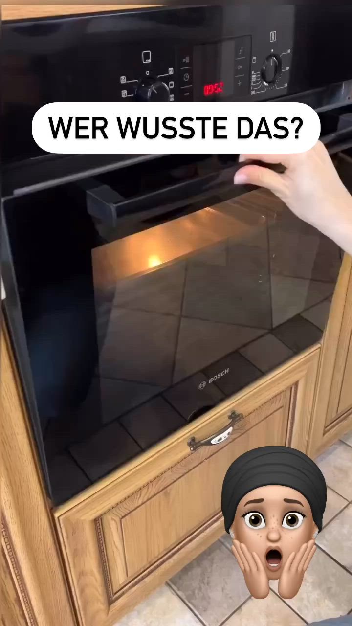 This may contain: an oven with the door open and a cartoon head sticking out of it