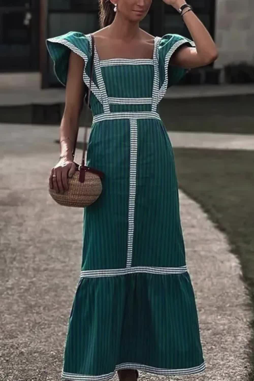 This contrast-paneled sleeveless square-neck maxi dress combines modern style with sophistication. The bold panels create a striking visual effect, while the square neckline adds a contemporary touch. Perfect for making a statement, this dress is a versatile choice for elegant evenings and special occasions.