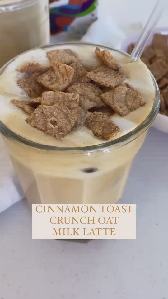 This may contain: cinnamon toast crunch oat milkshake in a glass