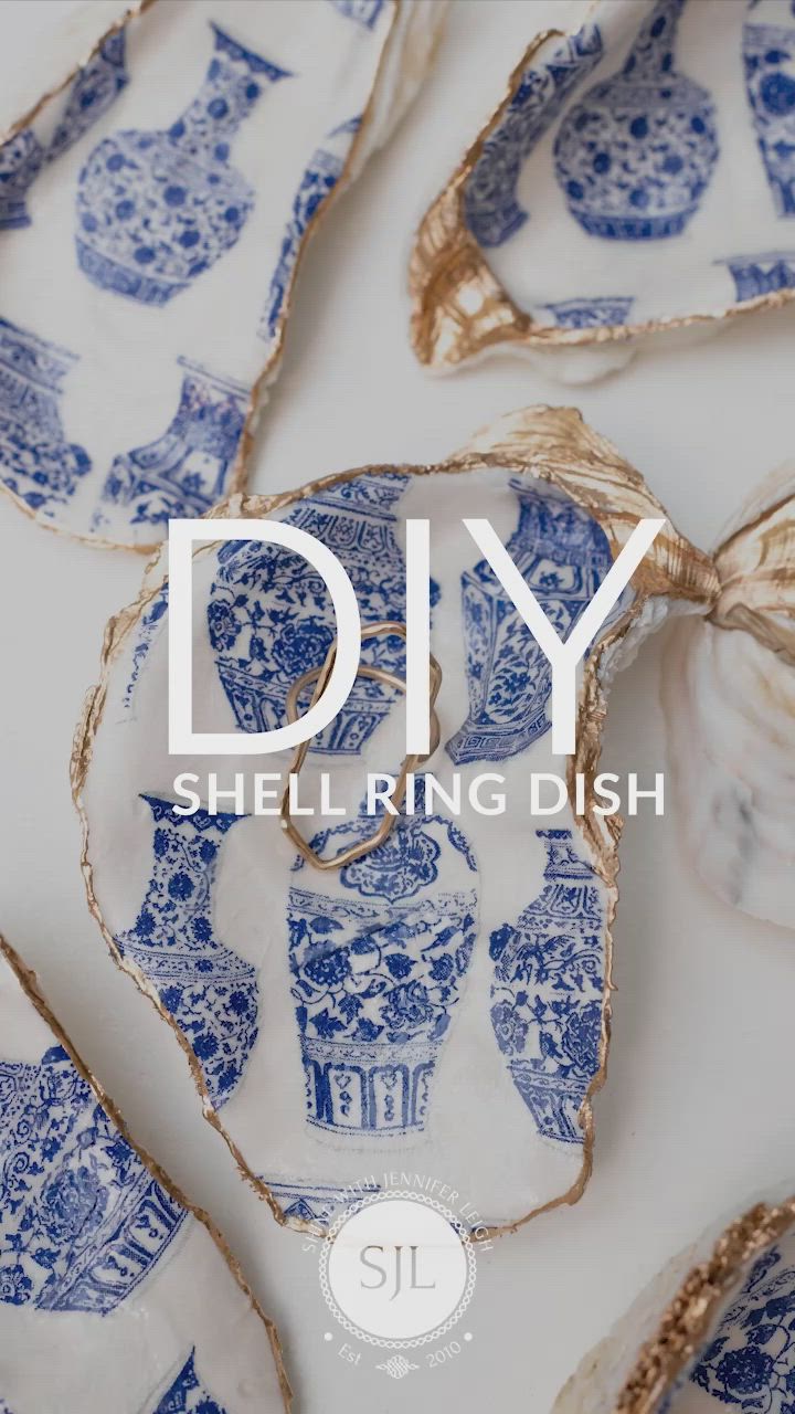 This may contain: blue and white dishes with the words diy shell ring dish on top of them