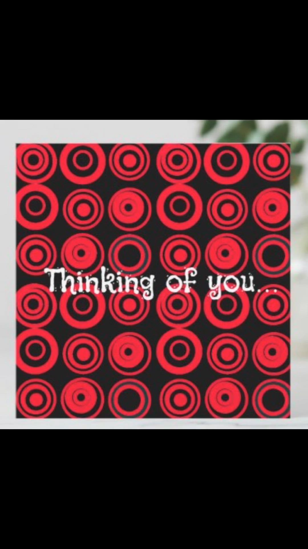 This may contain: a red and black greeting card with the words thinking of you in white lettering on it