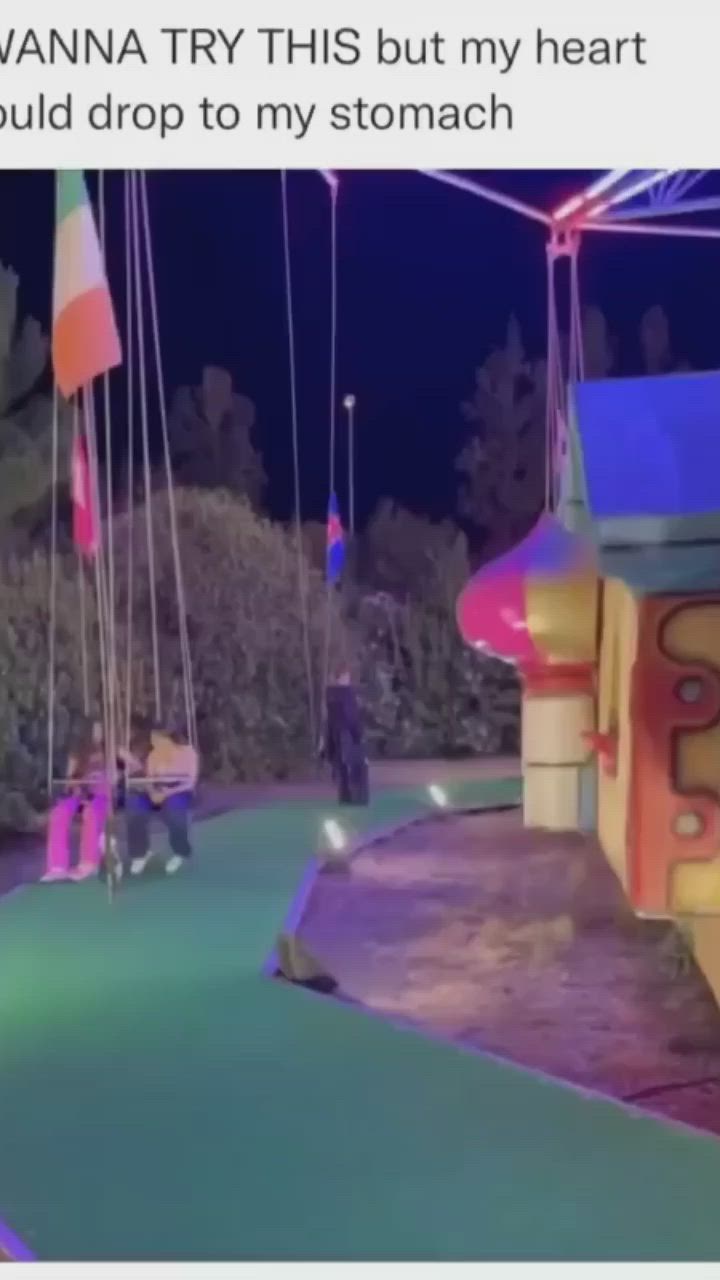 This may contain: two children ride on swings in an amusement park at night with caption that reads, wanna try this but my heart would drop to my stomach