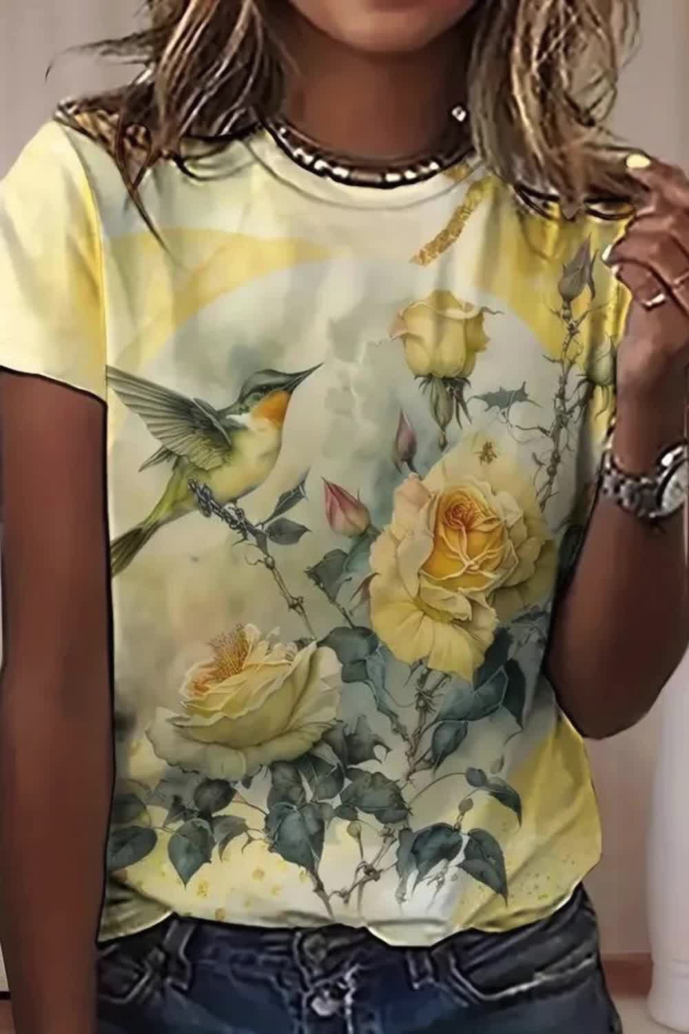 Add a touch of nature-inspired charm to your wardrobe with this Floral & Bird Print T-shirt. With its casual short sleeves and comfortable crew neck design, it's perfect for everyday wear. The delightful print of florals and birds adds a playful yet stylish element to any outfit.