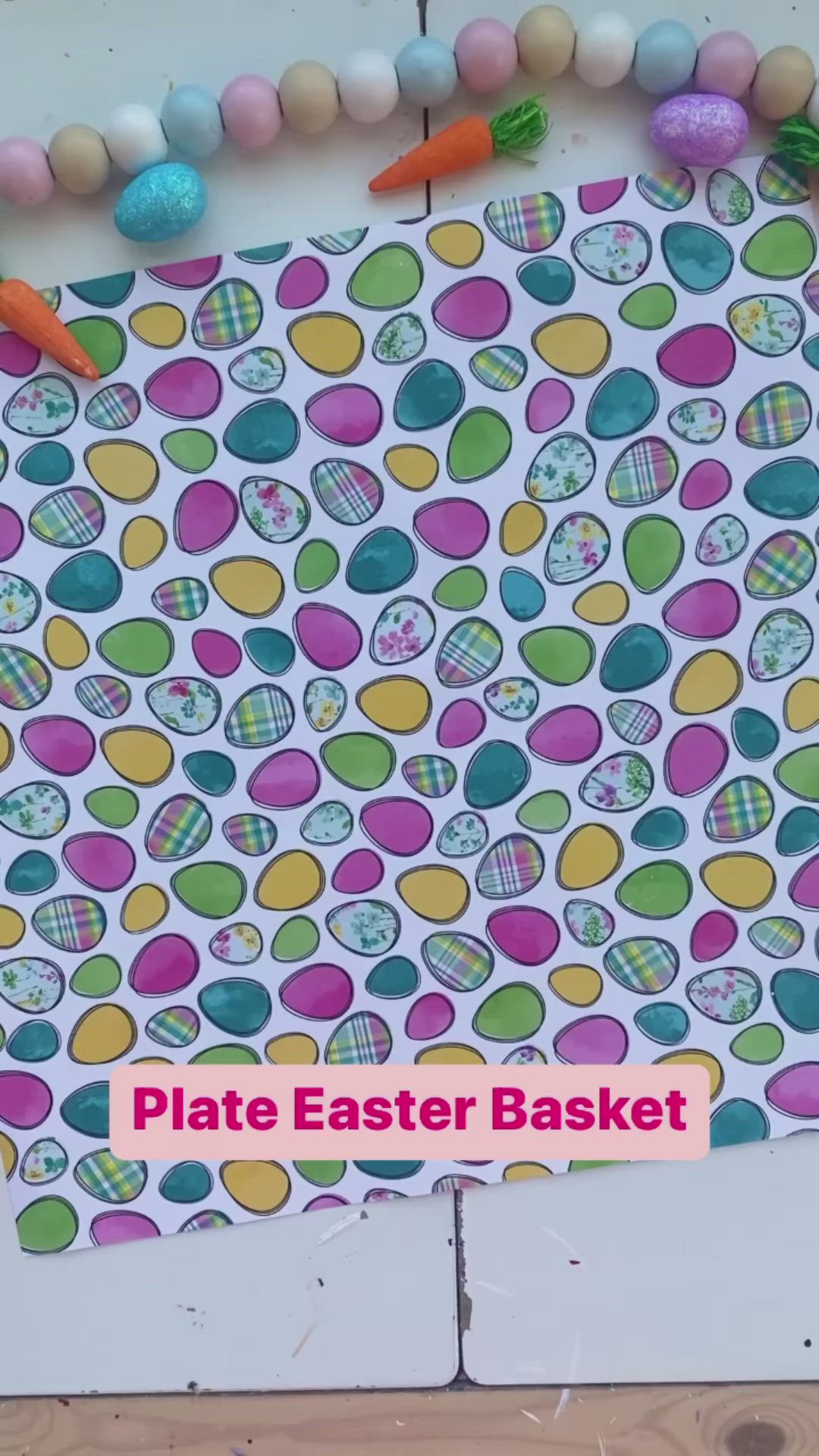 This may contain: a paper plate filled with candy and bunny ears