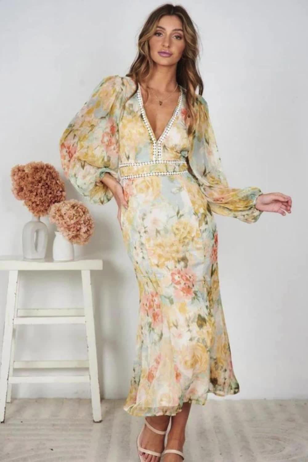 "Step into boho chic with our Women's V-Neck Boho Printed Midi Dress. This stylish dress features a flattering V-neck and vibrant boho prints, perfect for any casual summer occasion."