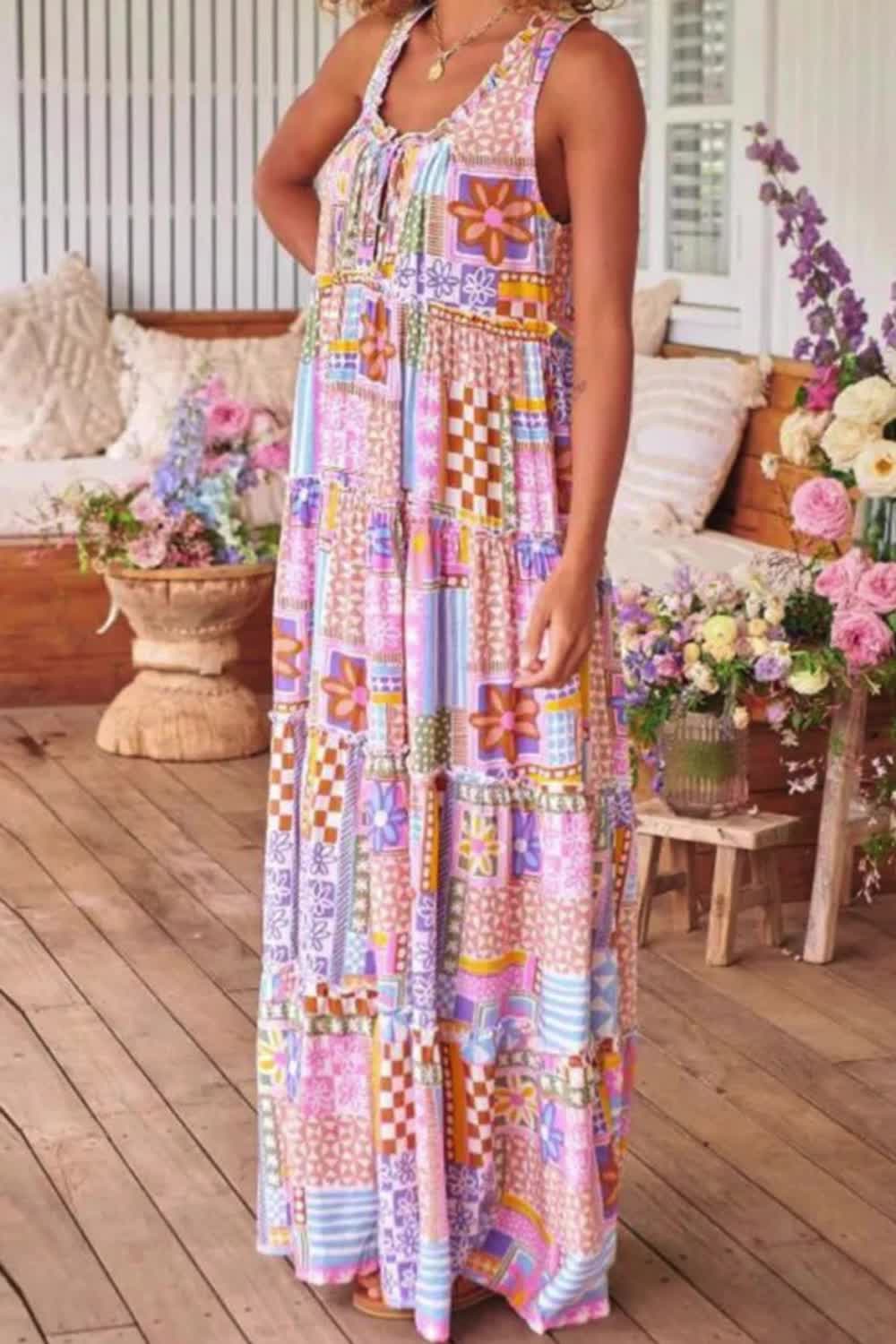 "Embrace bohemian charm with this Women's Sleeveless Floral Print Maxi Dress. Perfect for summer days, its breezy silhouette and captivating floral print capture the essence of boho chic. Effortlessly stylish and endlessly comfortable, this dress is a must-have for your warm-weather wardrobe."