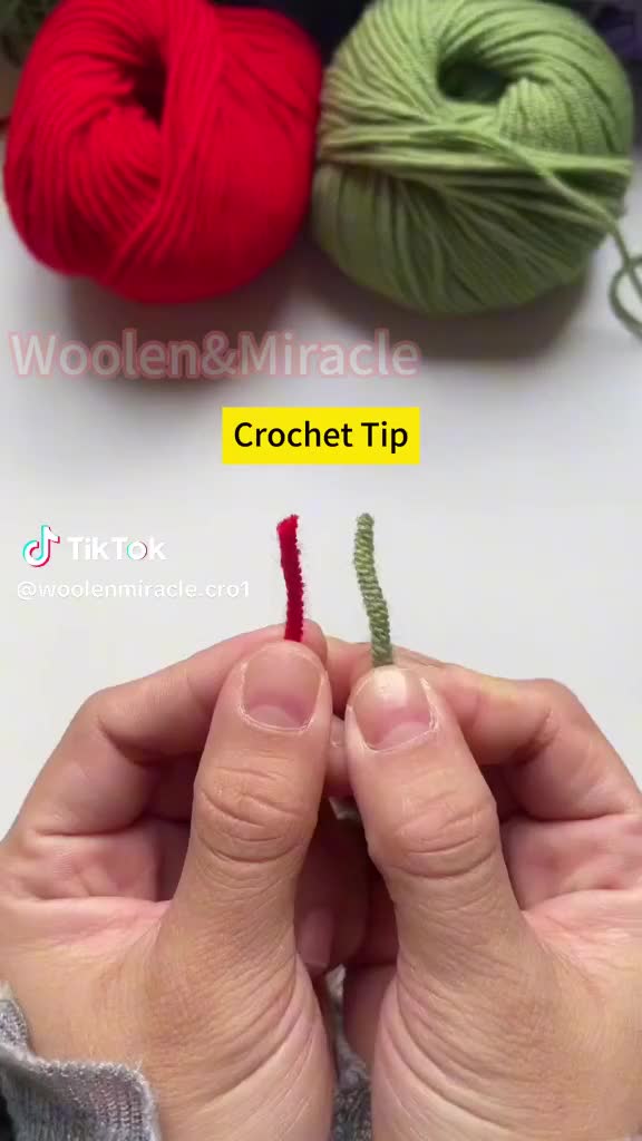 This may contain: someone is knitting yarn with their fingers and the needle has been crochet tip