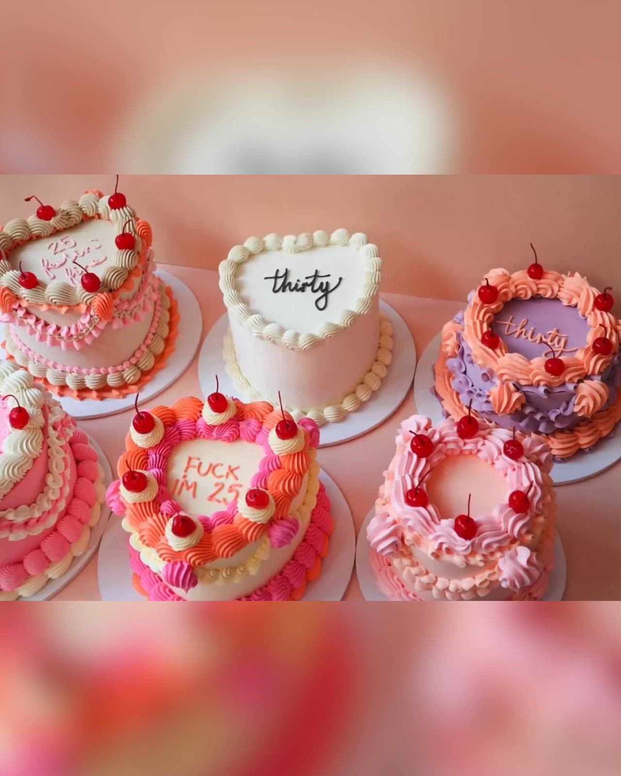 This may contain: there are many cakes that have been decorated with words on the top, and hearts in the middle