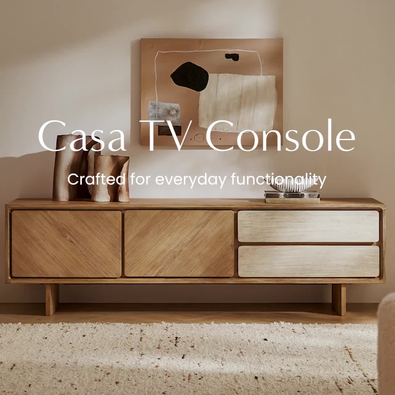 This may contain: the tv console is made out of wood and has an abstract painting above it that reads, casa tv console created for everyday functionality