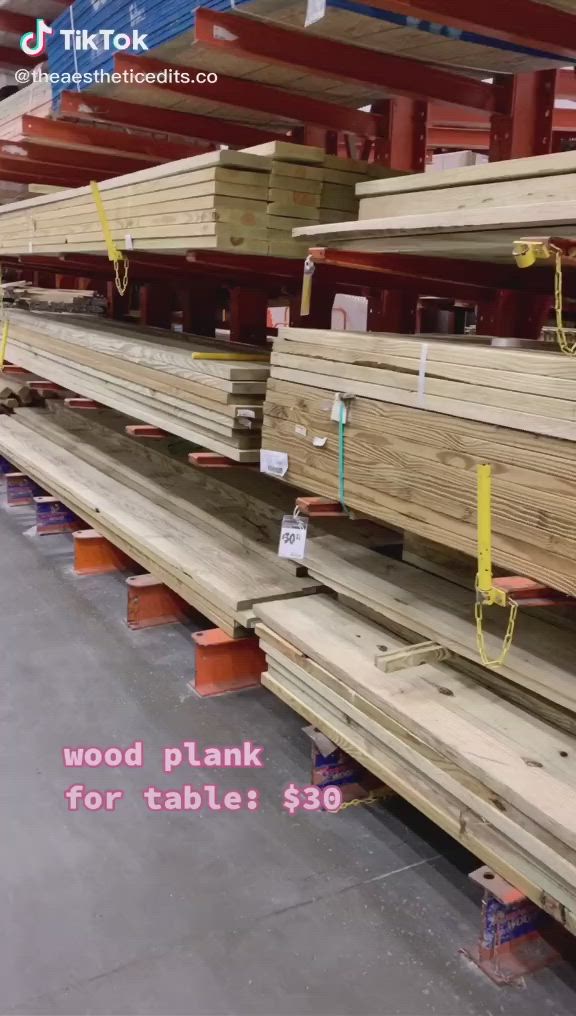 This may contain: wood planks for sale in a warehouse