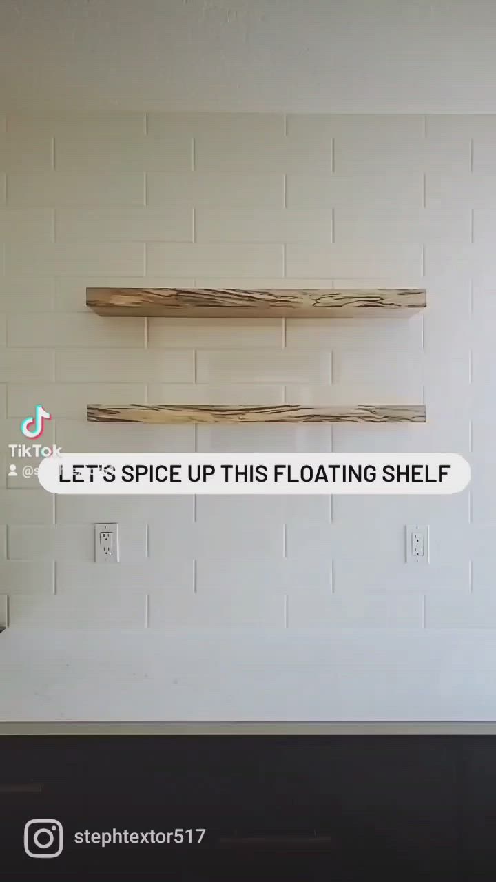 This may contain: two floating shelfs on the wall in a room