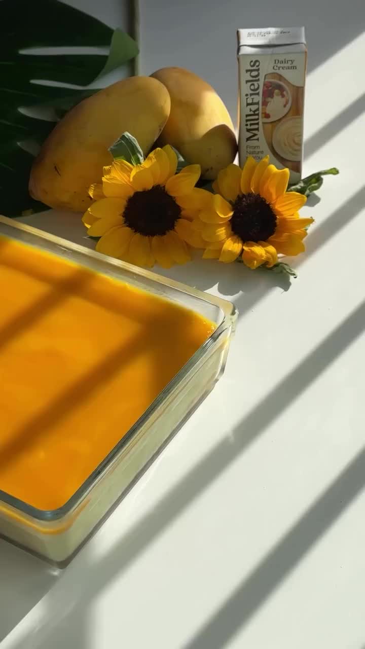 Indulge in the heavenly flavors of our Mango Tiramisu! This luscious dessert combines layers of mango-infused mascarpone cream, ladyfingers soaked in mango syrup, and fresh mango slices for a tropical twist on the classic Italian treat. 🥭🍮🌿 Perfect for summer gatherings or a sweet escape, this recipe is a delightful combination of creamy, fruity, and oh-so-decadent! 🌞🌴✨