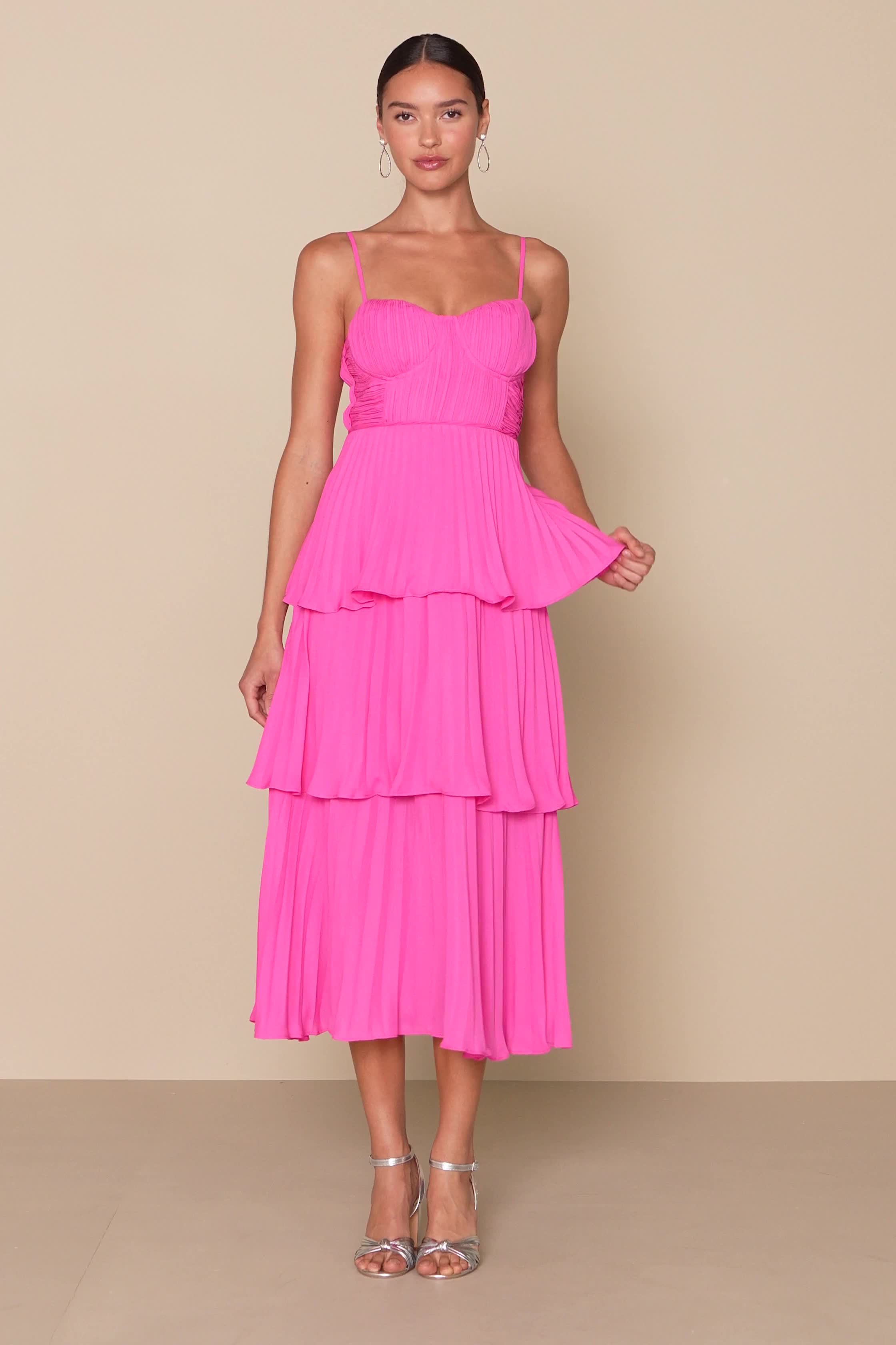 Get ready to be swept away to a world of romance by the Lulus Cascading Crush Hot Pink Tiered Midi Dress! Lightweight pleated woven fabric shapes adjustable spaghetti straps that support a bustier-style bodice with seamed cups. A fitted waist tops a tiered skirt that ends at a midi hem. Hidden back zipper/clasp. Fit: This garment fits true to size. Length: Mid-calf length. Size medium measures 44.5" from top to bottom. Bust: Great for any cup size. Waist: Fitted - very fitted at natural waist. H