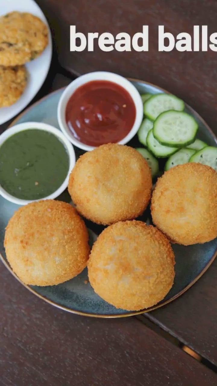 This may contain: bread balls on a plate with dipping sauces and cucumbers