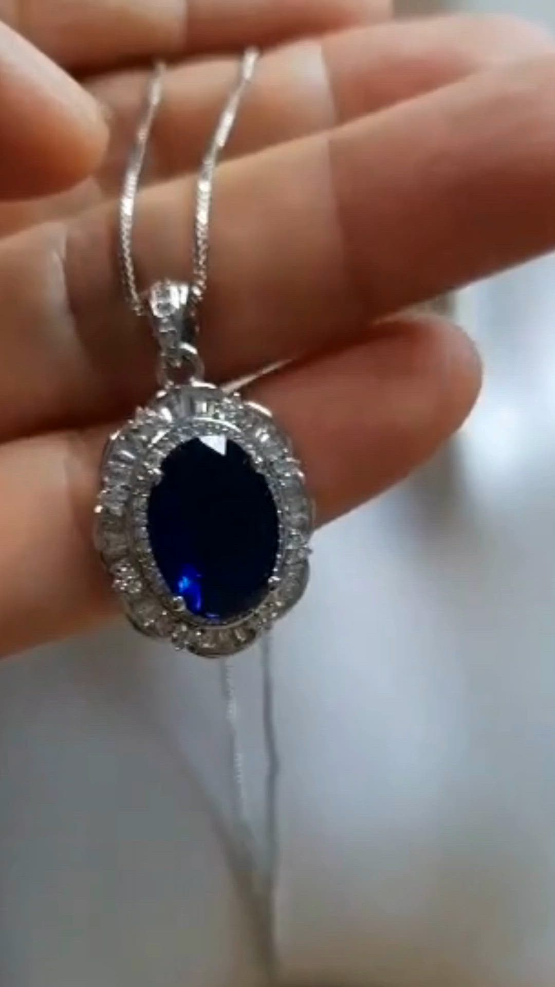 This contains: Shine like the night sky in this beautiful sparkling pendant and chain.  It is a beautiful piece that complements your personal style with this jewelry for any special occasion.