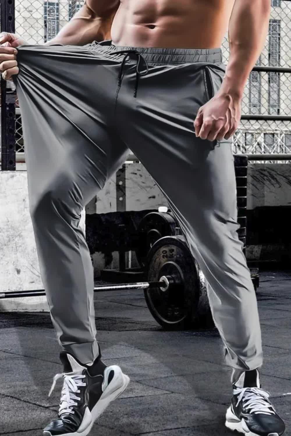 "Stay active with these men's summer and spring sports training pants. Featuring a waist drawstring, quick-dry, high-stretch fabric, and solid color, they offer comfort and functionality. Zipper pockets provide secure storage, making them ideal for outdoor activities and workouts."