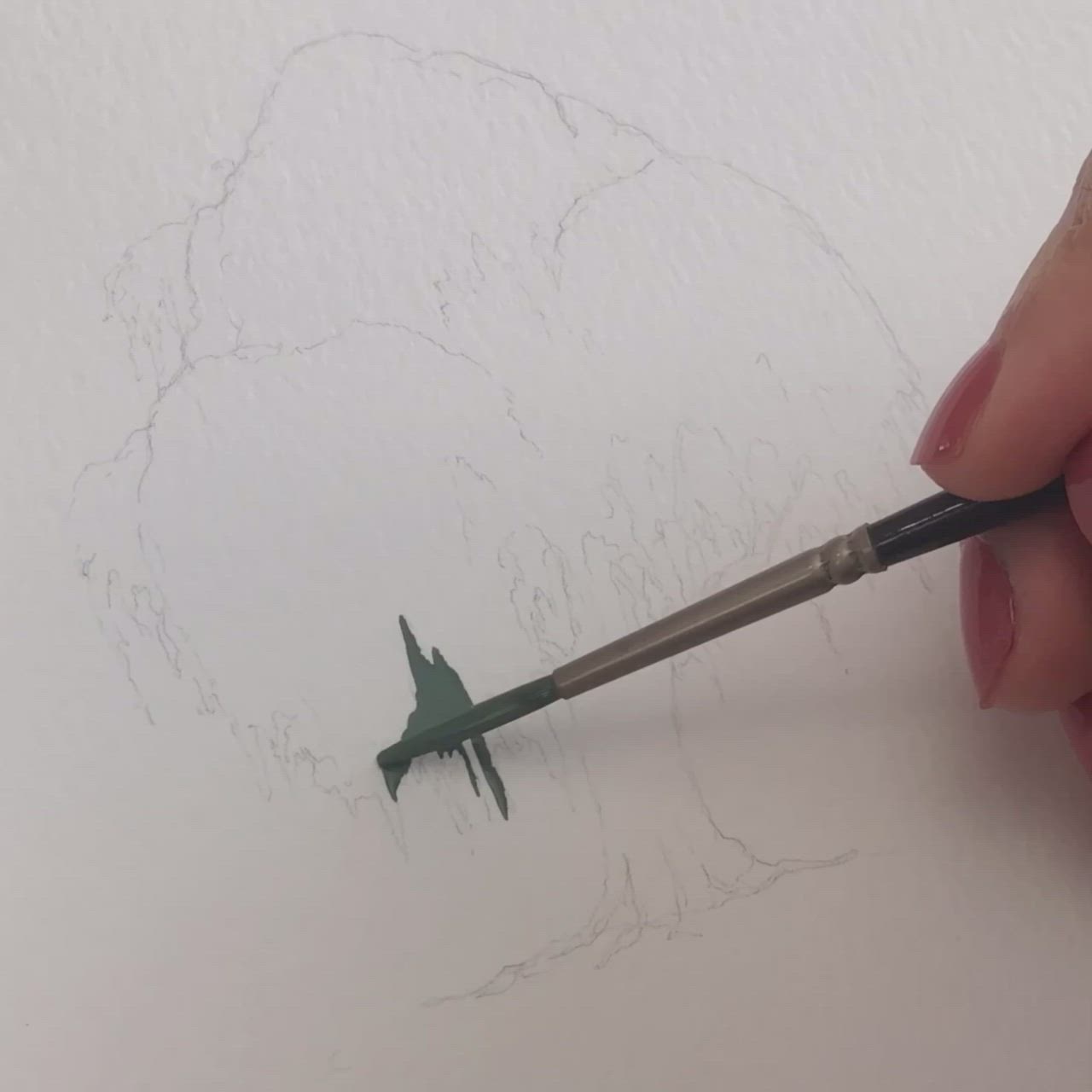 This may contain: someone is drawing a tree with green leaves