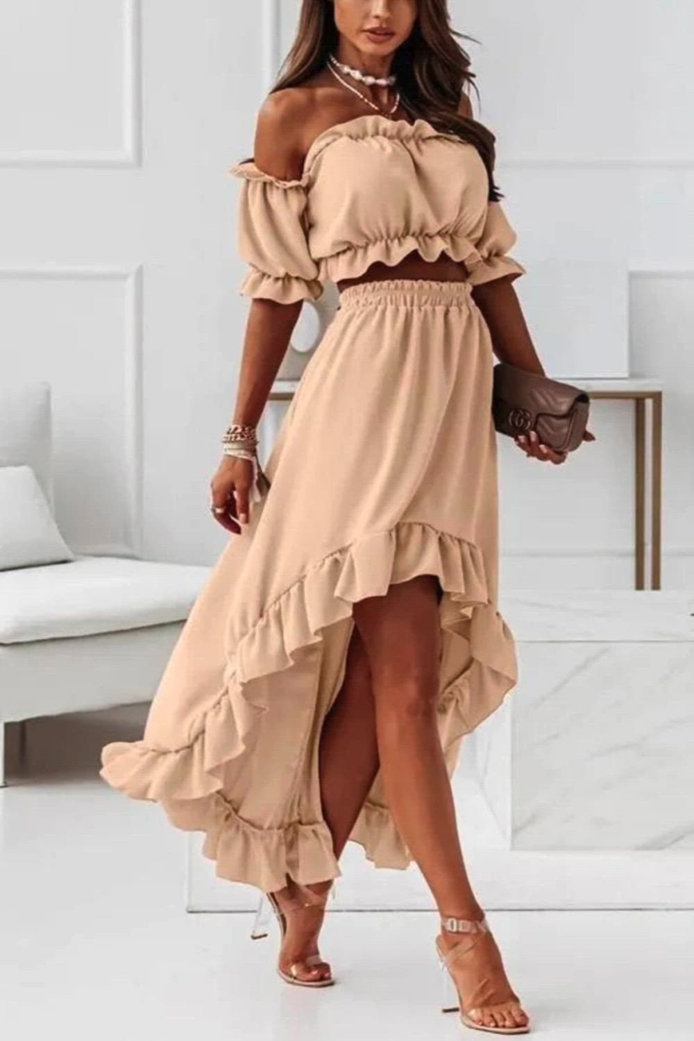 Elevate your style with our Off-The-Shoulder Midi Dress Suit. This chic ensemble combines modern sophistication with a touch of allure. The off-the-shoulder neckline adds a flirty edge, while the midi length exudes elegance. Perfect for various occasions, this dress suit is a versatile choice that effortlessly transitions from day to night. Embrace a contemporary yet timeless look with this fashion-forward ensemble.