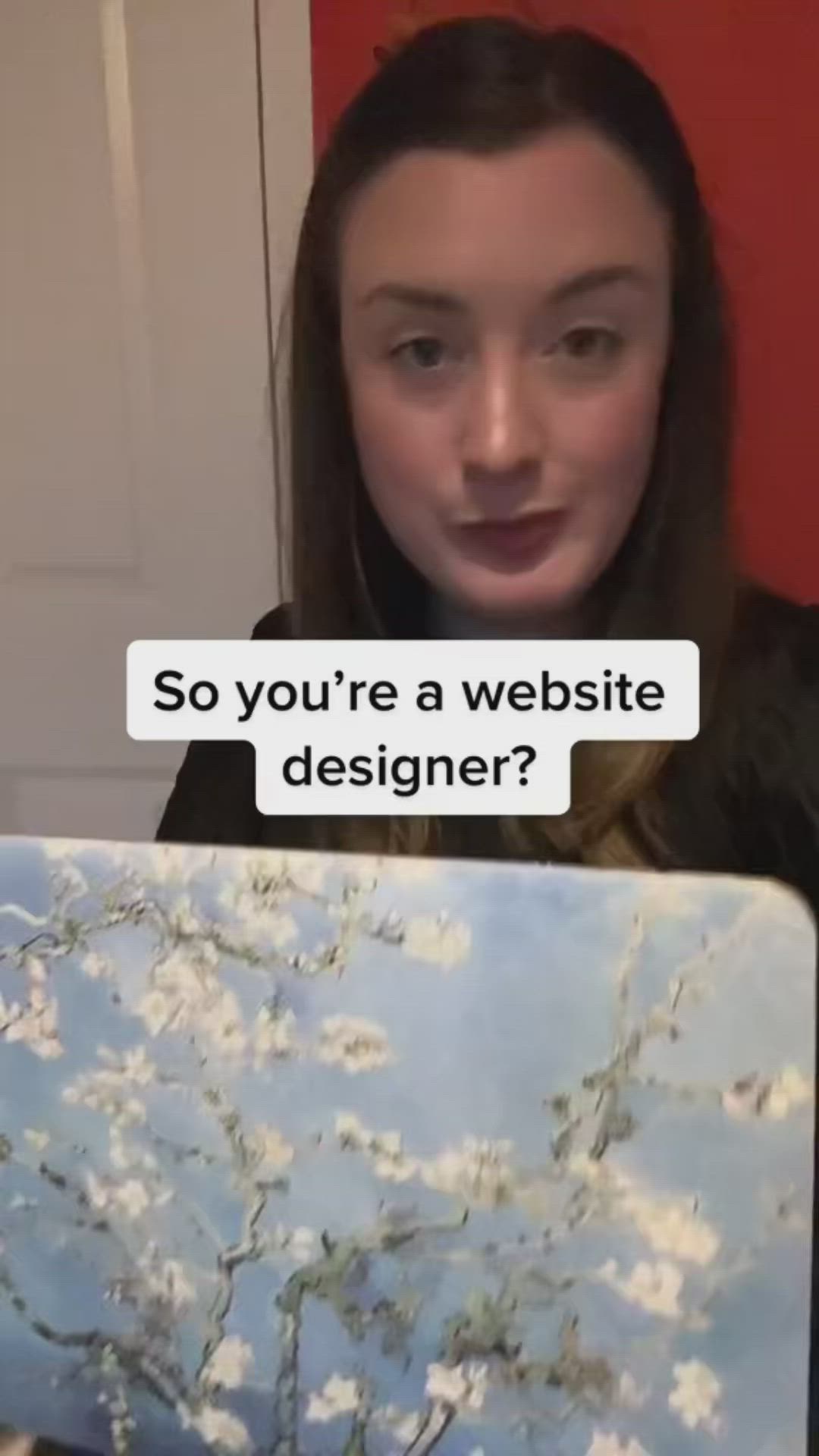 This may contain: a woman holding a laptop with the caption so you're a website designer?