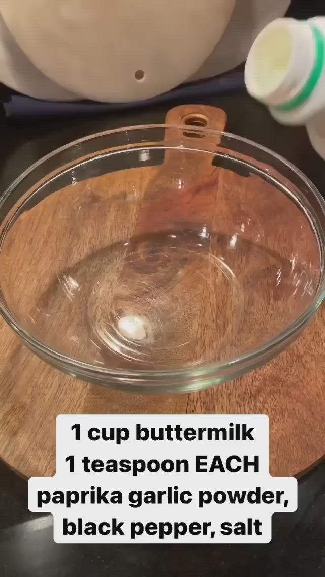 This may contain: a glass bowl filled with liquid sitting on top of a table