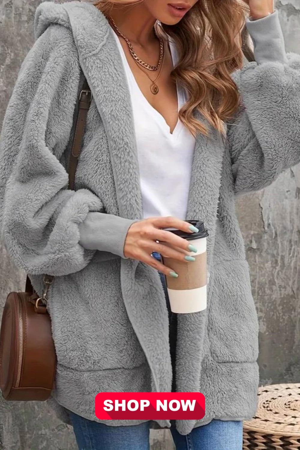 This Women's Plus Solid Teddy Fleece Coat is the ultimate blend of style and comfort for plus-size fashion enthusiasts. Crafted with plush faux fur, it boasts a long sleeve design, an open front, and a cozy hood. Elevate your casual look with this tunic-length coat, perfect for chilly days.