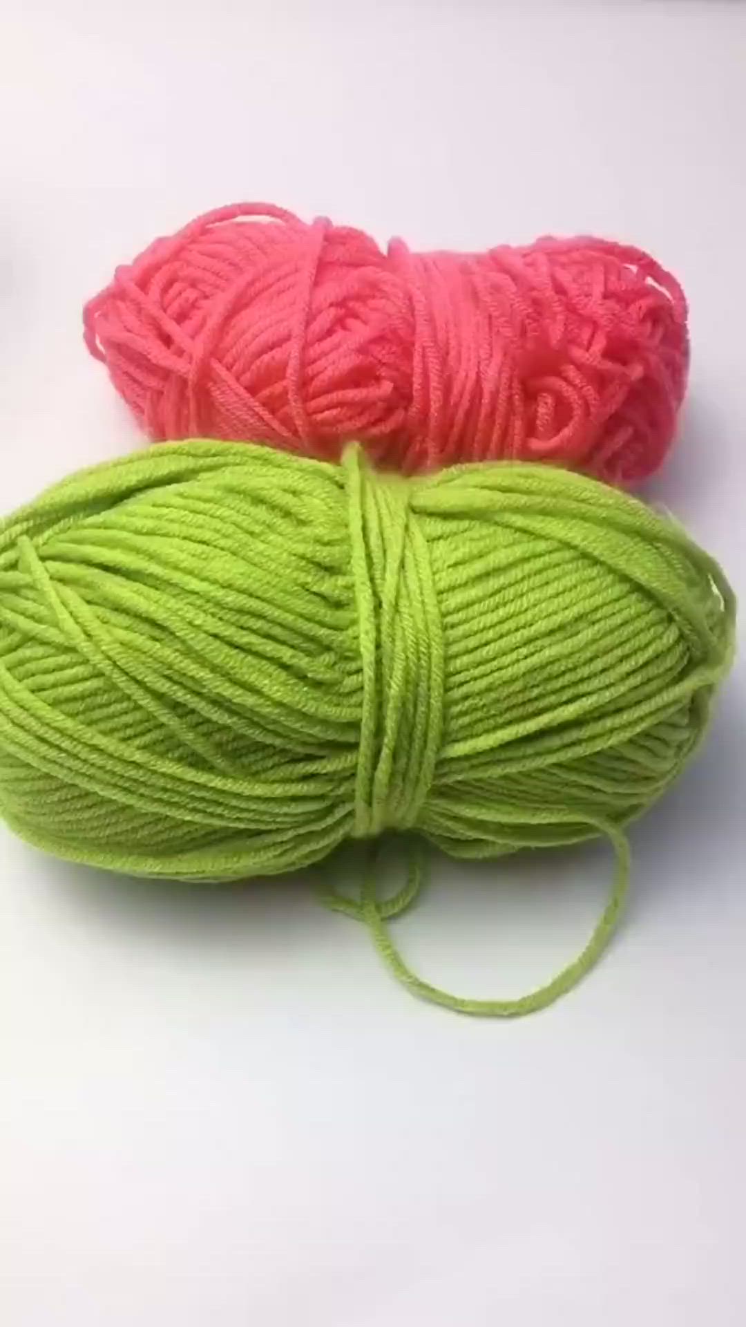 This may contain: two skeins of yarn sitting next to each other on top of a white surface