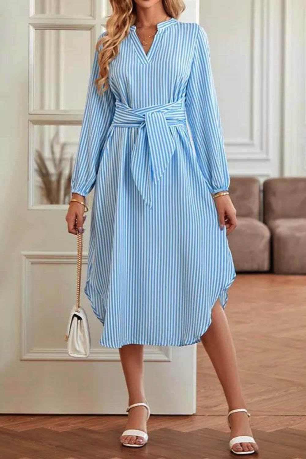 Elevate your style with our A-Line Long Sleeves Striped Tied Waist V-Neck Midi Dress. This dress strikes the perfect balance between comfort and sophistication, featuring a flattering A-line silhouette, long sleeves, and a chic V-neck. The striped pattern adds a touch of modern flair, while the tied waist accentuates your figure beautifully. Whether you're heading to the office or a social event, this midi dress is a versatile and fashionable choice.