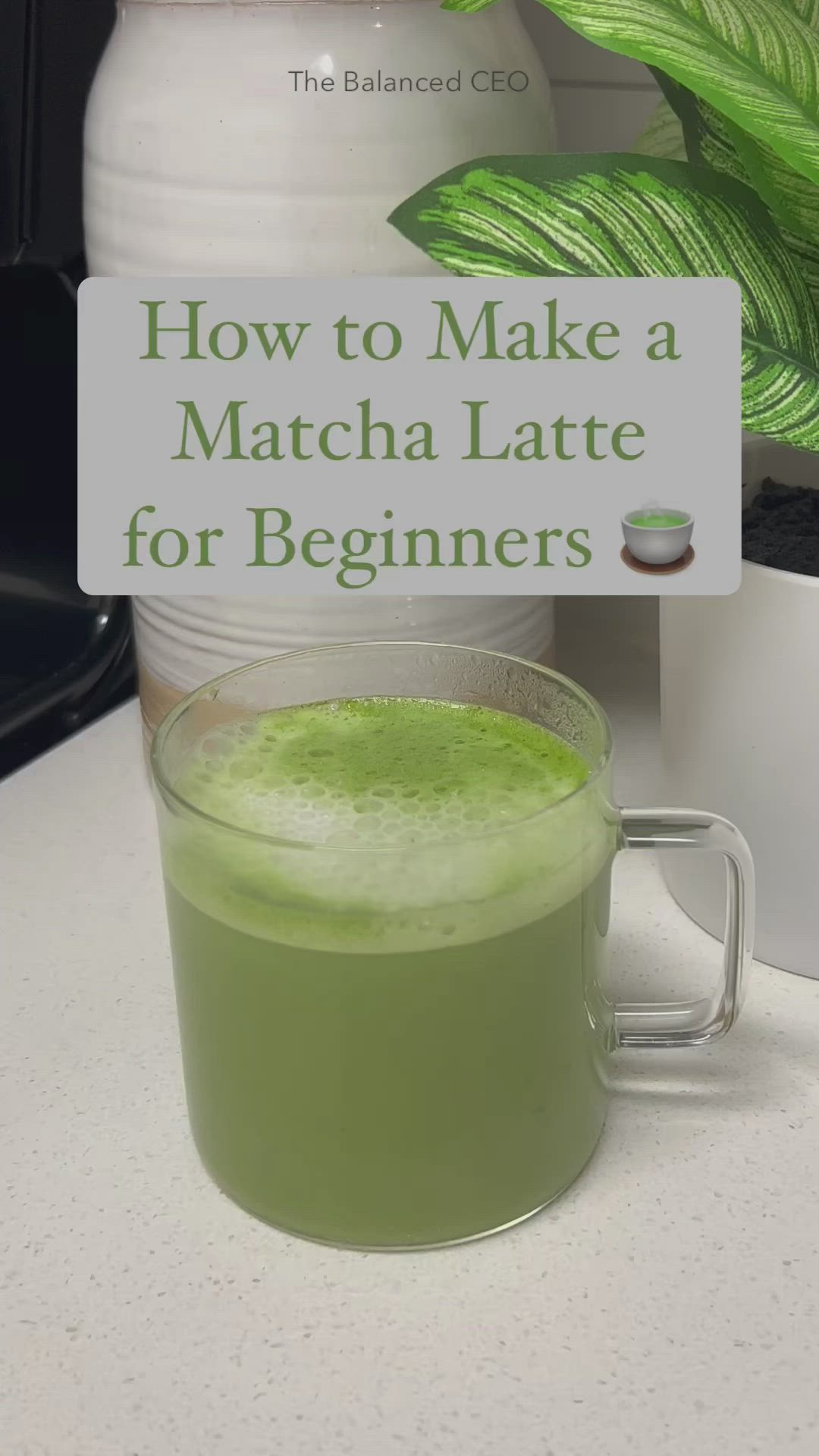 This may contain: a green drink sitting on top of a table next to a sign that says how to make a matcha latte for beginners