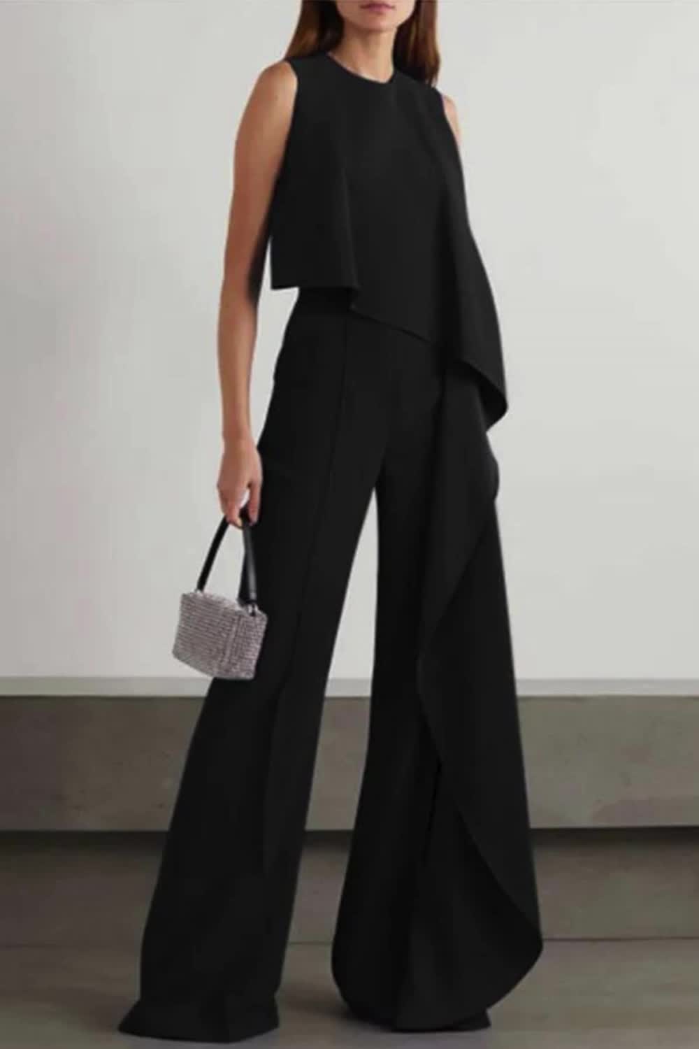 "The 'Amazing Views' Irregular Hem Wide Leg Formal Party Jumpsuit exudes elegance and charm. With its irregular hem and wide-leg design, it offers a unique silhouette that stands out. Perfect for formal parties, it combines style and sophistication, ensuring you make a stunning impression wherever you go."