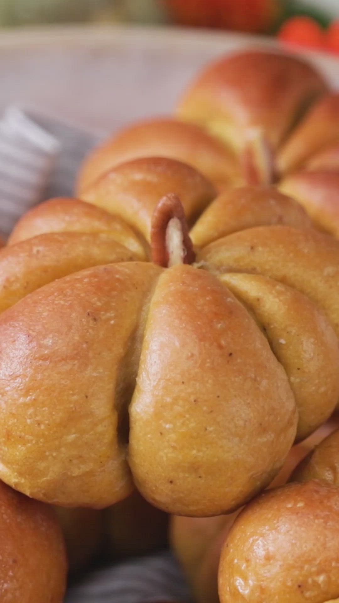 This may contain: a bunch of bread rolls sitting on top of a white plate