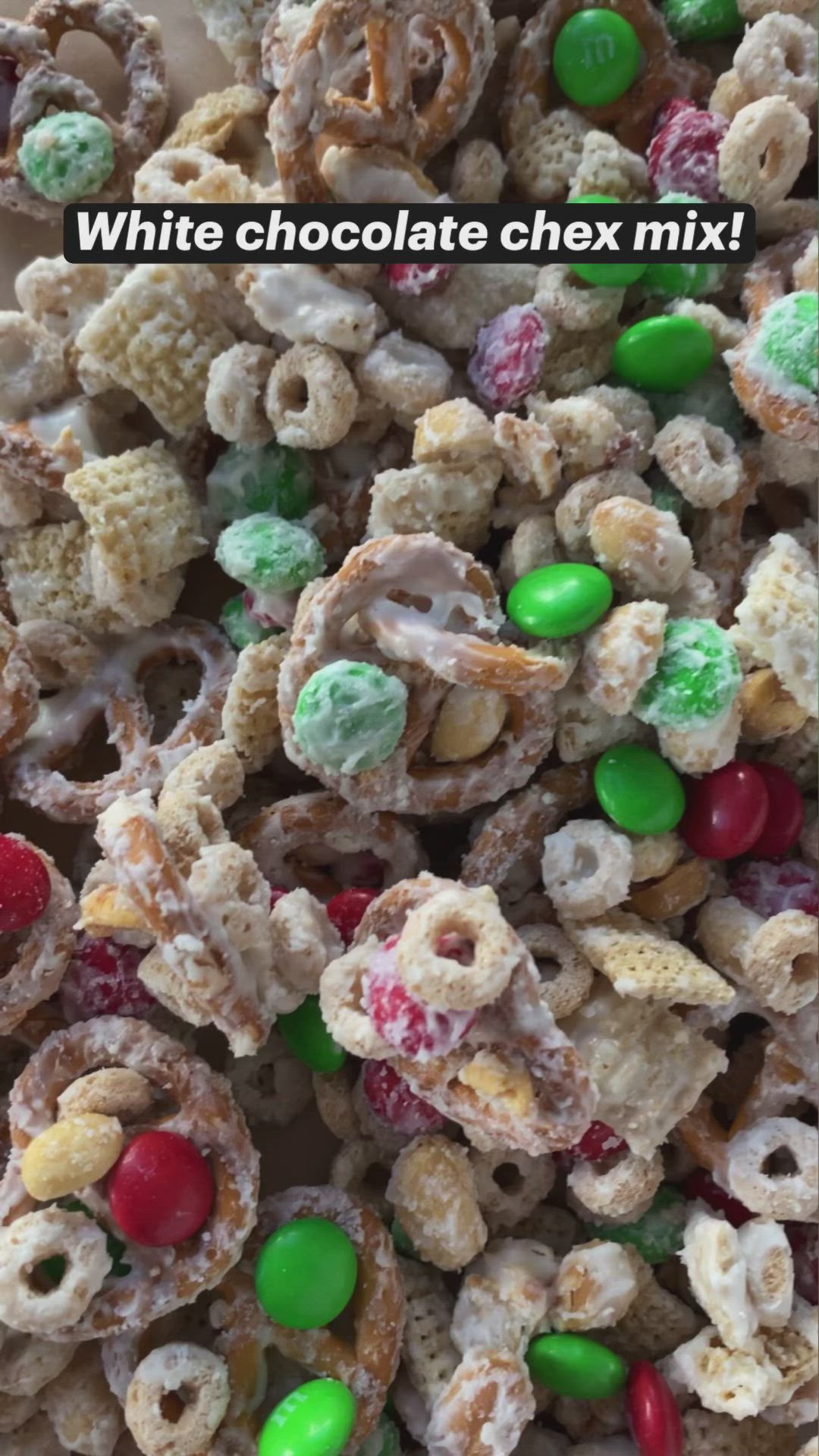 This may contain: white chocolate chex mix with candy and m & m candies in the middle