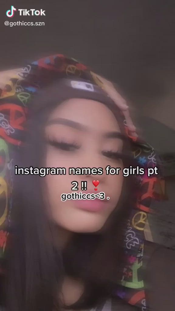 This may contain: a woman with her head covered in colorful letters and the words instagram names for girls pt