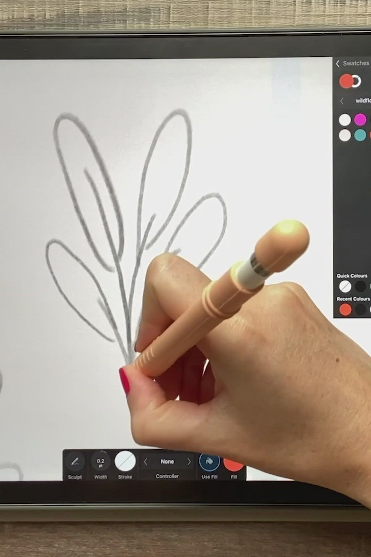 This may contain: a person is drawing on a computer screen with a pencil and eraser in their hand