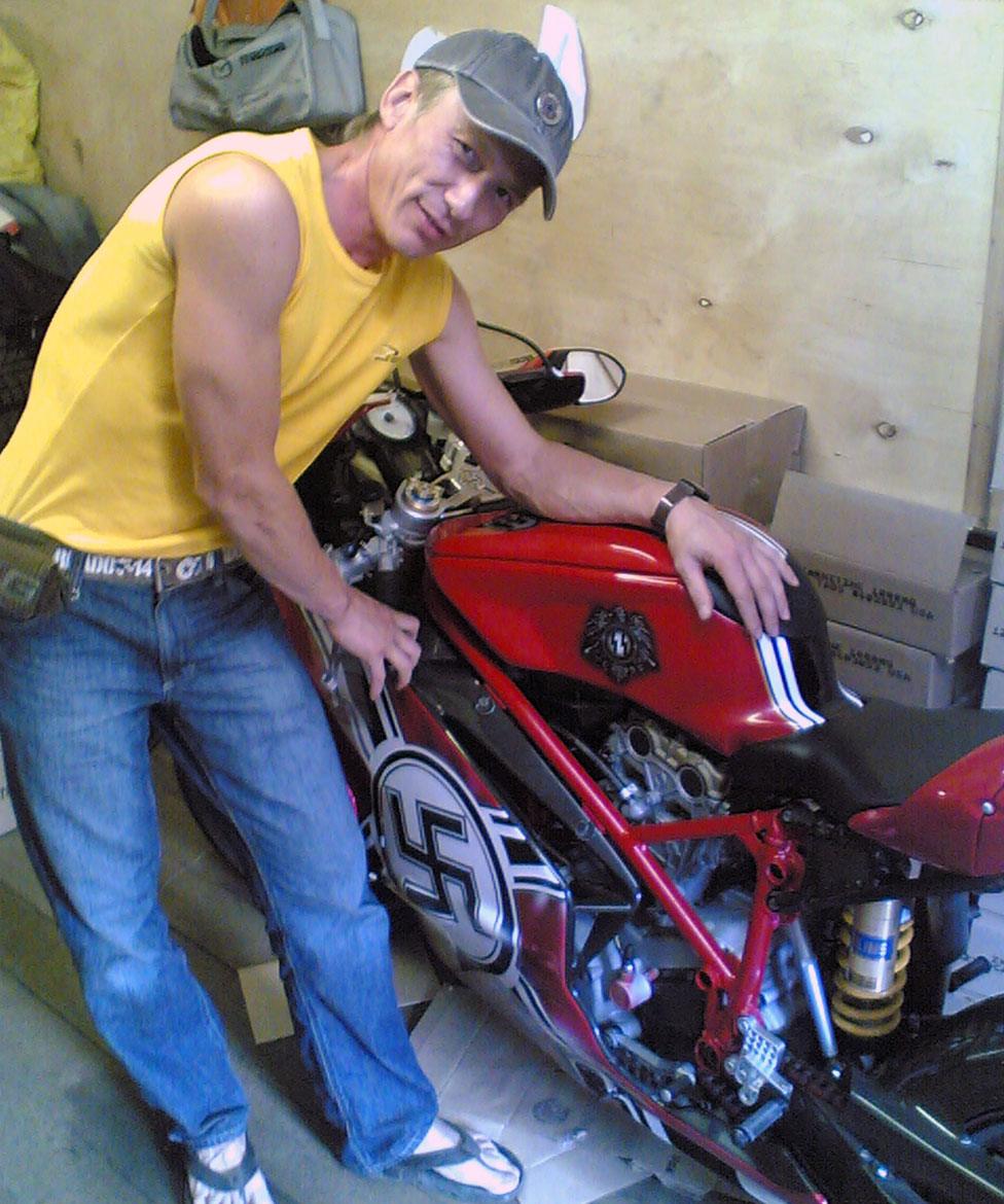 Nadim Ayupov with the motorbike plastered with Nazi symbols