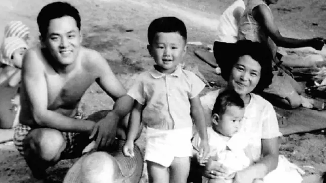 Yoji Ochia and his parents, here on Hiroshima beach in 1966, disagree over the need for an apology