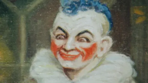 A painted portrait of clown Joseph Grimaldi - a man with white, red and black facepaint, blue hair.