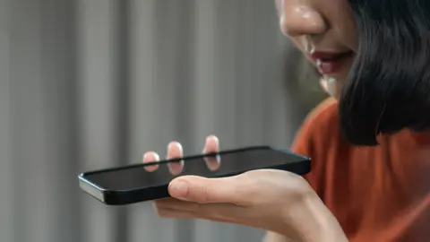 Woman holding an iPhone