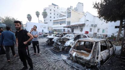 FILE PHOTO: People inspect the area of Al-Ahli hospital where hundreds of Palestinians were killed in a blast that Israeli and Palestinian officials blamed on each other, and where Palestinians who fled their homes were sheltering amid the ongoing conflict with Israel,  in Gaza City, October 18, 2023.  REUTERS/Mohammed Al-Masri/File Photo