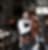 Man carrying leather goods in his leather shop