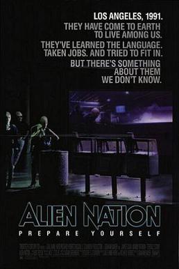 A black poster. Above in bold letters are the lines: "Los Angeles, 1991." "They have come to earth to live among us." "They've learned the language." "Taken jobs." "And tried to fit in." "But there's something about them we don't know." Below, in large typeface is the line: "Alien Nation" and in smaller typeface, the line: "Prepare Yourself"; with the film credits underneath. In the background are three extraterrestrials standing on a street corner. One of the figures is a female standing next to a waste basket and three newspaper stands, holding a jacket over her shoulders. Behind her is a bar that features alien typography on its walls. Two extraterrestrials who are hanging out inside the bar, can be seen through its glass window.