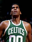 A man, wearing a green jersey with a word "CELTICS" and the number "00" written in the front, is looking up.