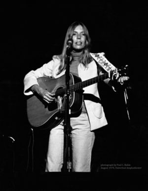 Joni Mitchell plays guitar in 1974