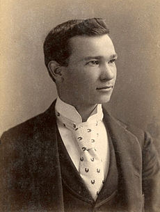 Formally-dressed young man, looking to the right